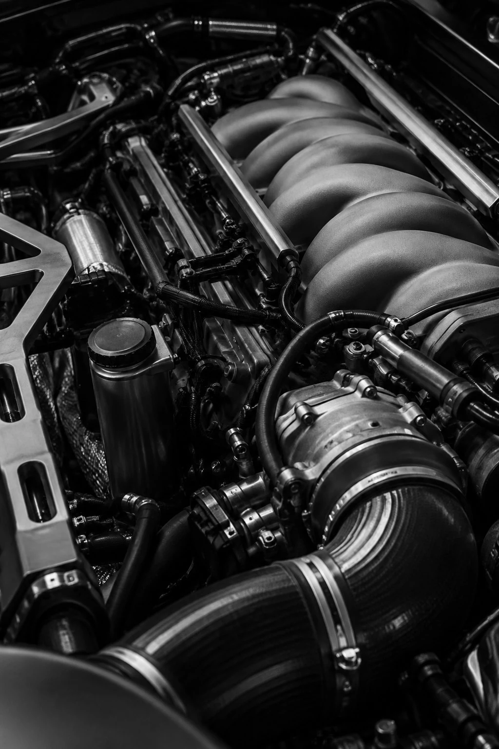 Detailed black and white view of a high-performance sports car engine